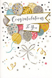 In this image, a stylish congratulations card stands tall, its design evoking the feeling of a festive sky filled with balloons gently drifting upward. The central focus is a generous bouquet of illustrated balloons gathered closely together, rendered in soft metallic shades of brushed gold, champagne, silver, sky blue, blush pink, and warm grey. Each balloon is adorned with small decorative touches-tiny stars, glitter-like sprinkles, subtle stripes-that catch the eye and hint at a shimmering surface, much like party balloons glowing under evening lights at a celebration in a Chigwell home. Thin gold and silver ribbon tails cascade from the base of the cluster, curling with natural, flowing movement similar to the gift ribbons we add to celebratory arrangements before local delivery. A graceful banner stretches across the middle of the balloons, gently arched and inscribed with the phrase Congratulations To You in elegant, looping calligraphy that feels personal and sincere. Around this central motif, the pale background is sprinkled with miniature stars, dots, and swirling lines, reminiscent of confetti or streamers floating through the air after a toast in one of Chigwell's cosy restaurants or garden parties. The overall atmosphere is joyful and light without being overwhelming, combining gentle glamour with heartfelt sentiment-an ideal companion to a bouquet marking a graduation, exam success, promotion, or any standout achievement that calls for both flowers and a card that truly honours the moment.